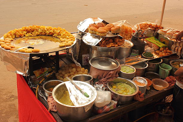 Street food stall with different chaat items in New Delhi, India.